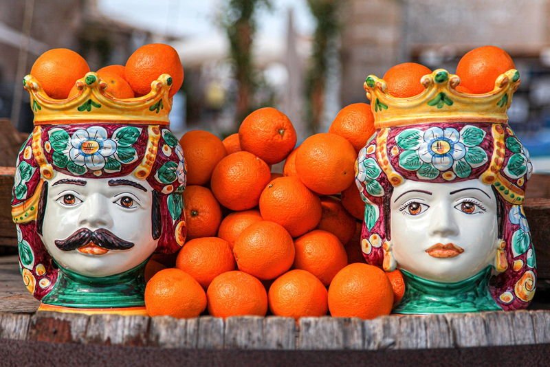 Hand-painted Sicilian teste di moro ceramic heads filled with oranges