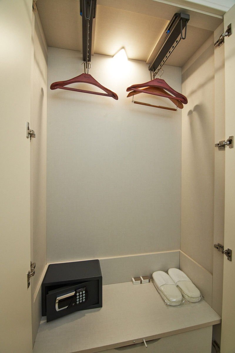 Walk-in wardrobe, safe and slippers inside